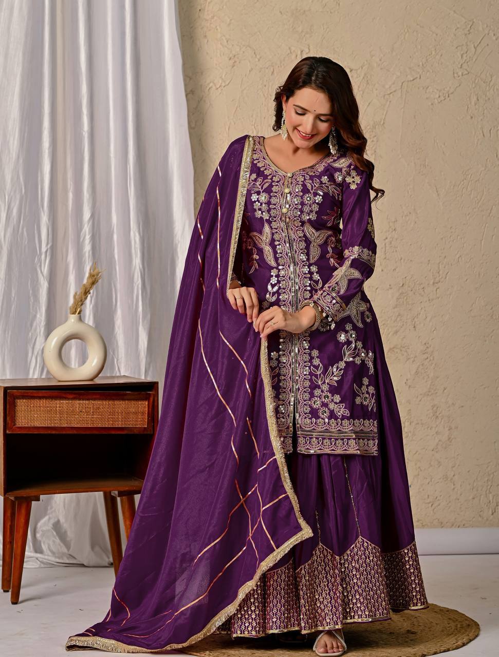 Regal Wine Purple Kurti and Flared Palazzo Suit Set Embellished with Intricate Floral Zari and Mirror Work